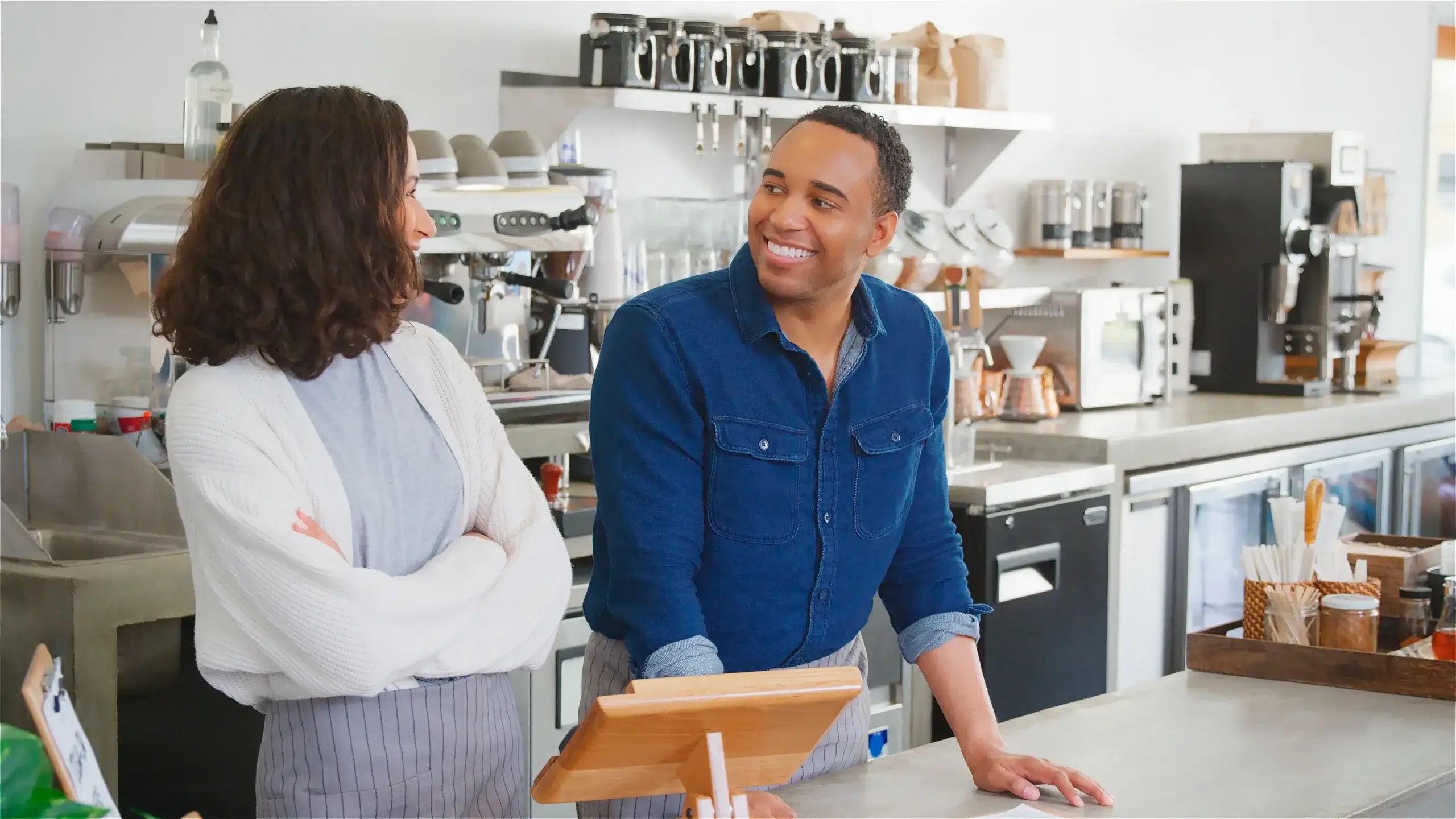 Welcoming cafe atmosphere with detailed menu board and friendly staff
