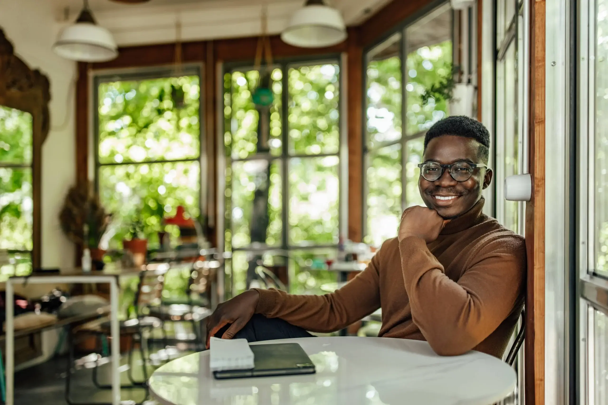 Adult man starting his workday with a smile, using SalesPlay White Label POS integrated with Serengeti Solutions Enhanced ERP